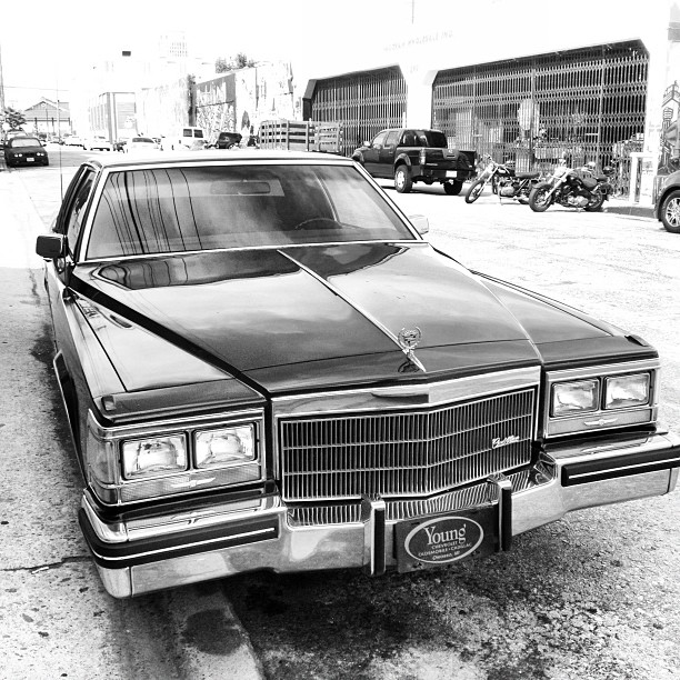 there is a classic black car that is parked