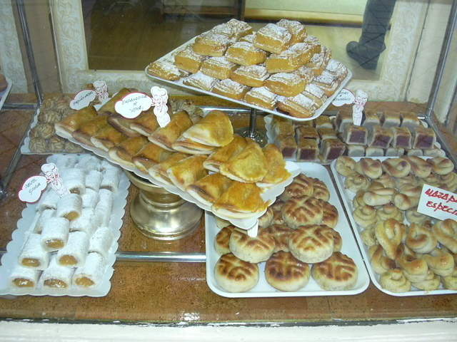 a bakery has baked goods in many trays