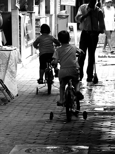 black and white pograph of people on bicycles