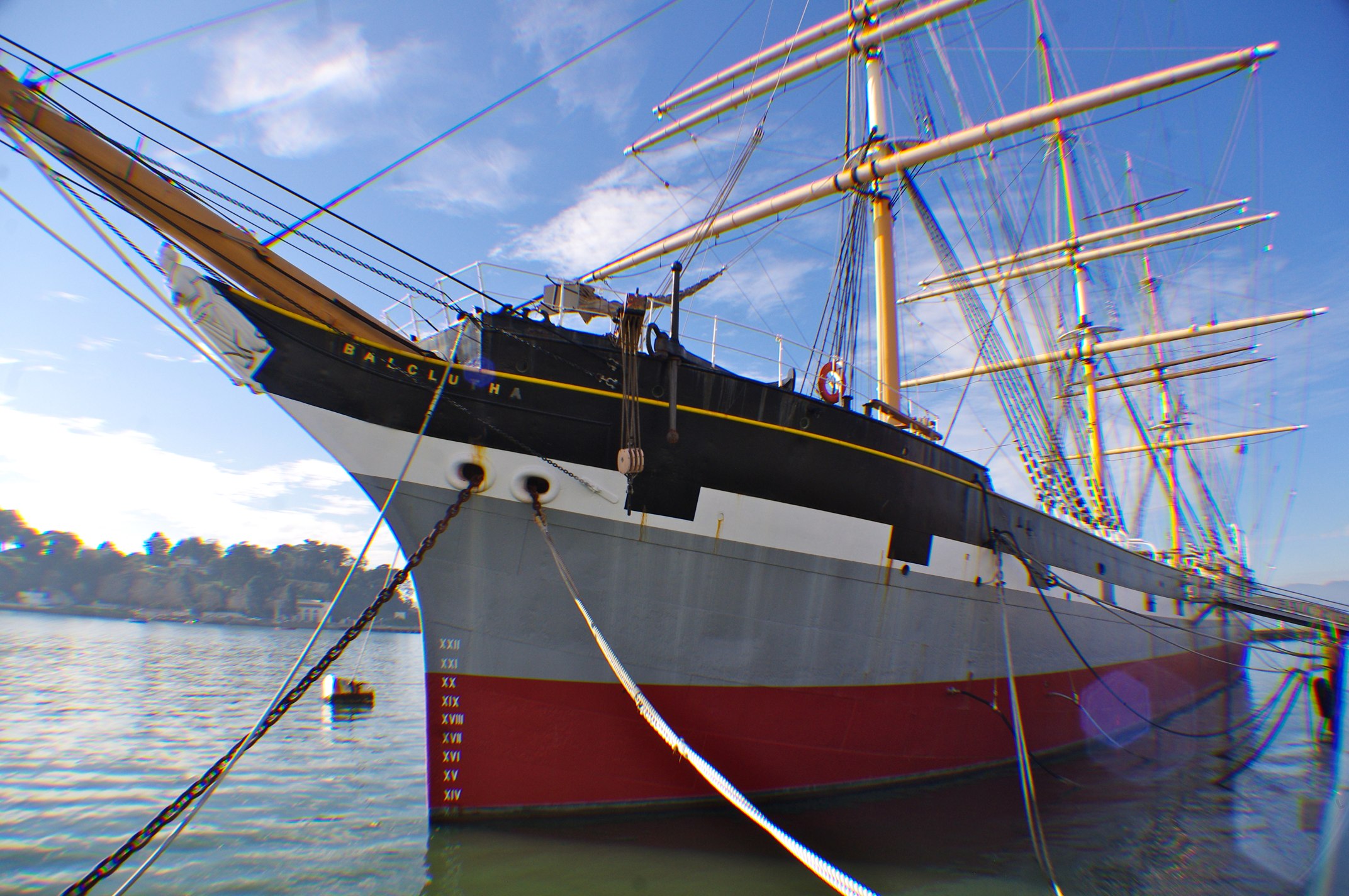 a large boat tied to a rope on water