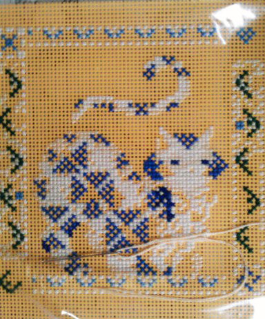 a close up of a cross stitch pattern on fabric