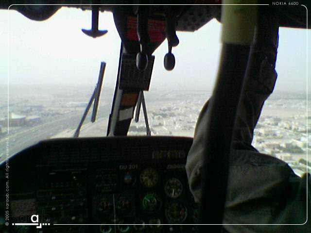the view out of the cockpit of an airplane shows many objects hanging from the ceiling