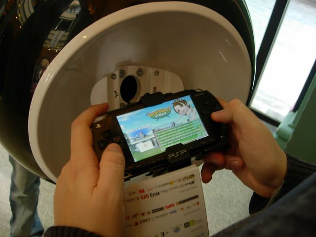 a person playing wii on a smartphone