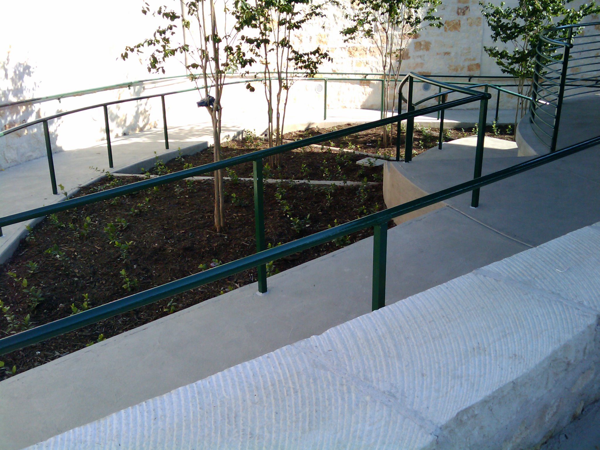 the skateboarder is practicing on his board down the railing