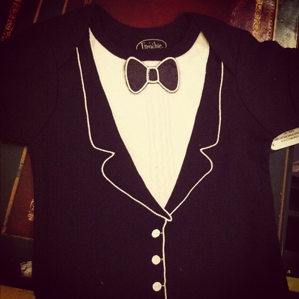 the shirt has a bow tie and a tuxedo on it