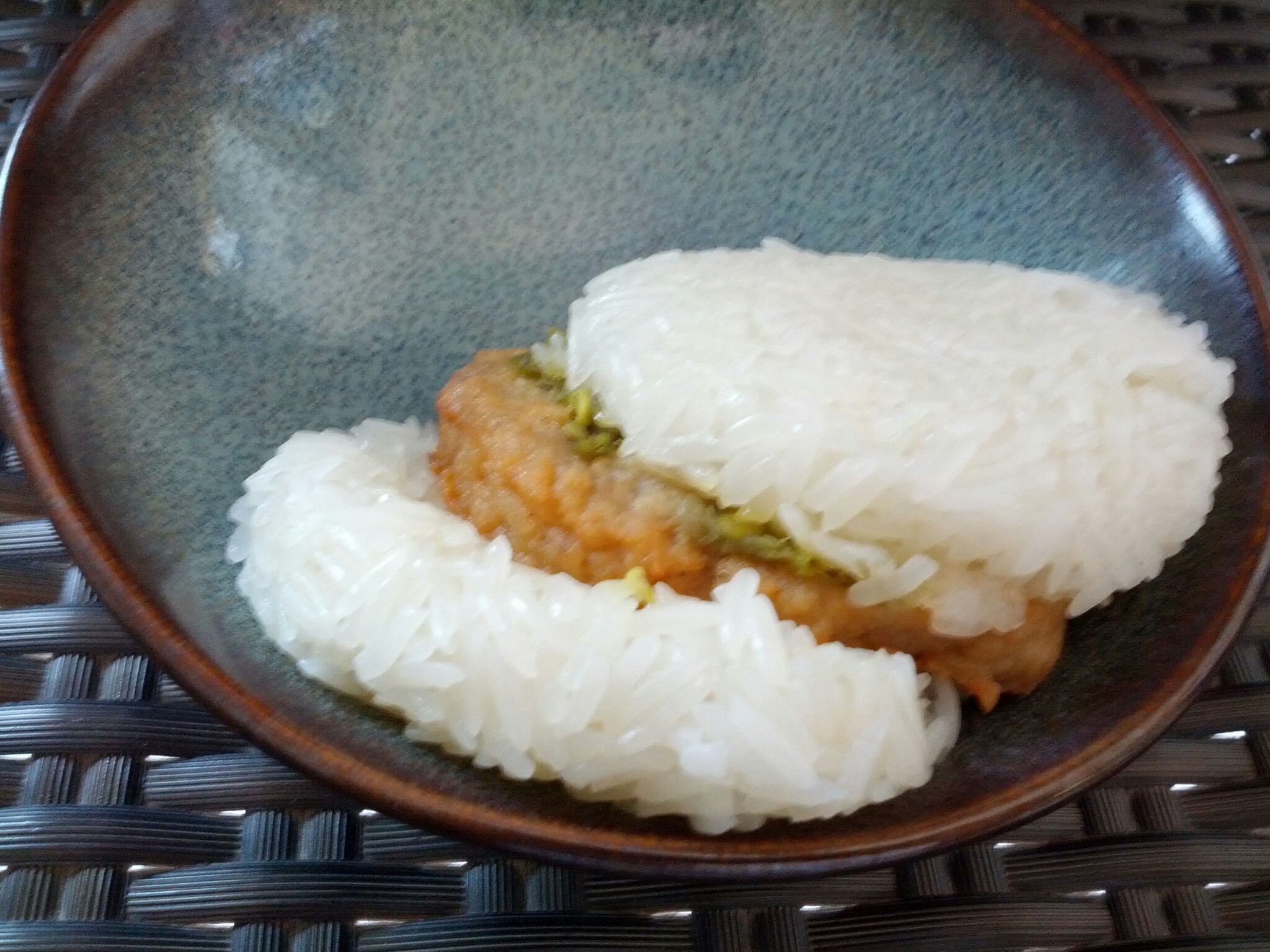 rice is piled high on a plate to make a dish