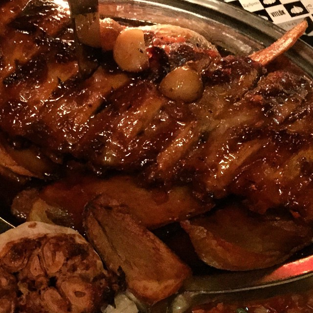 a tray with steaks and other meat on it