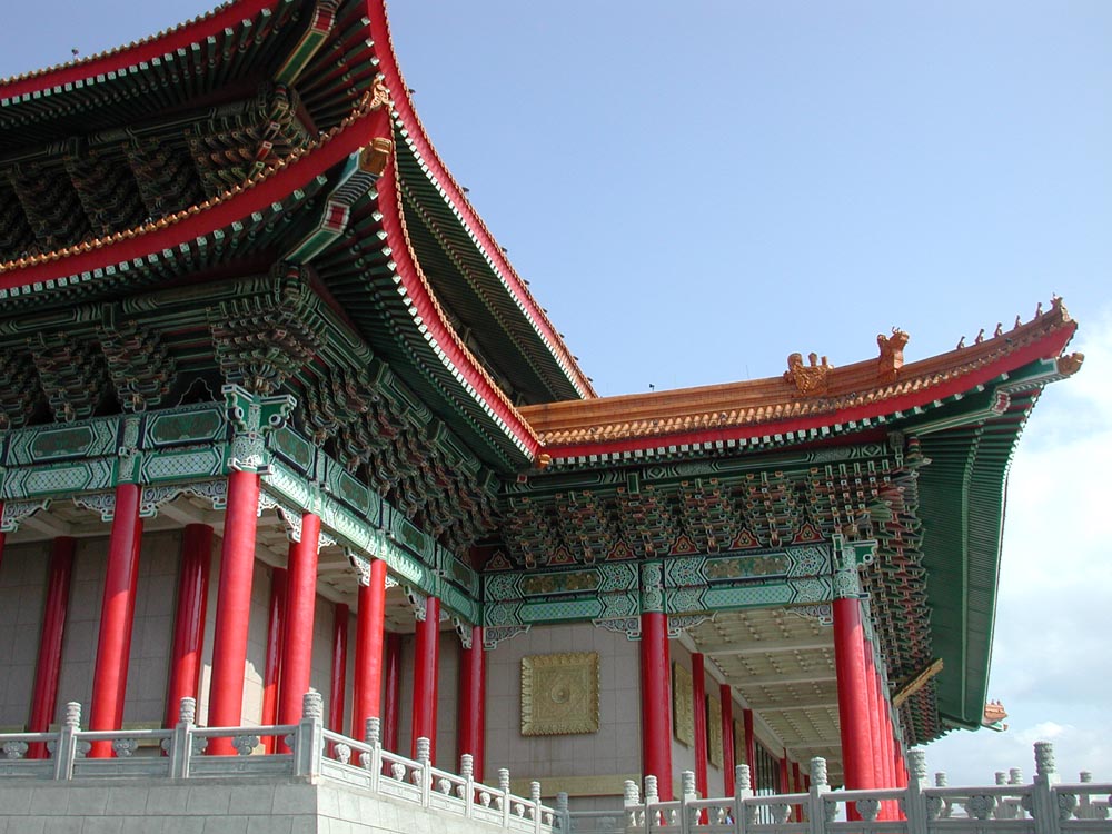 a chinese temple with red pillars and arches