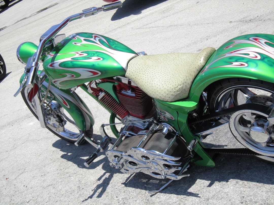 the motor bike has been painted with green paint