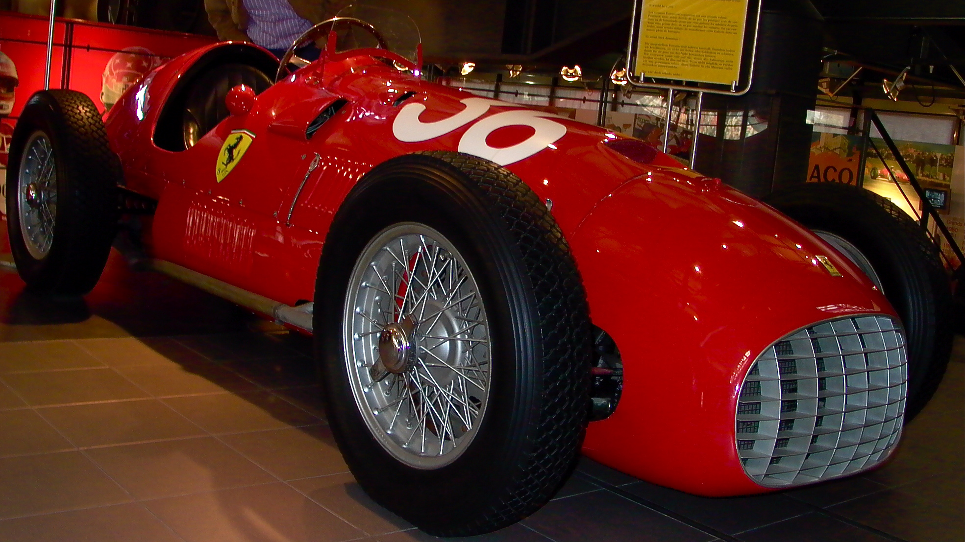 a red racing car with the word joy painted on it's side