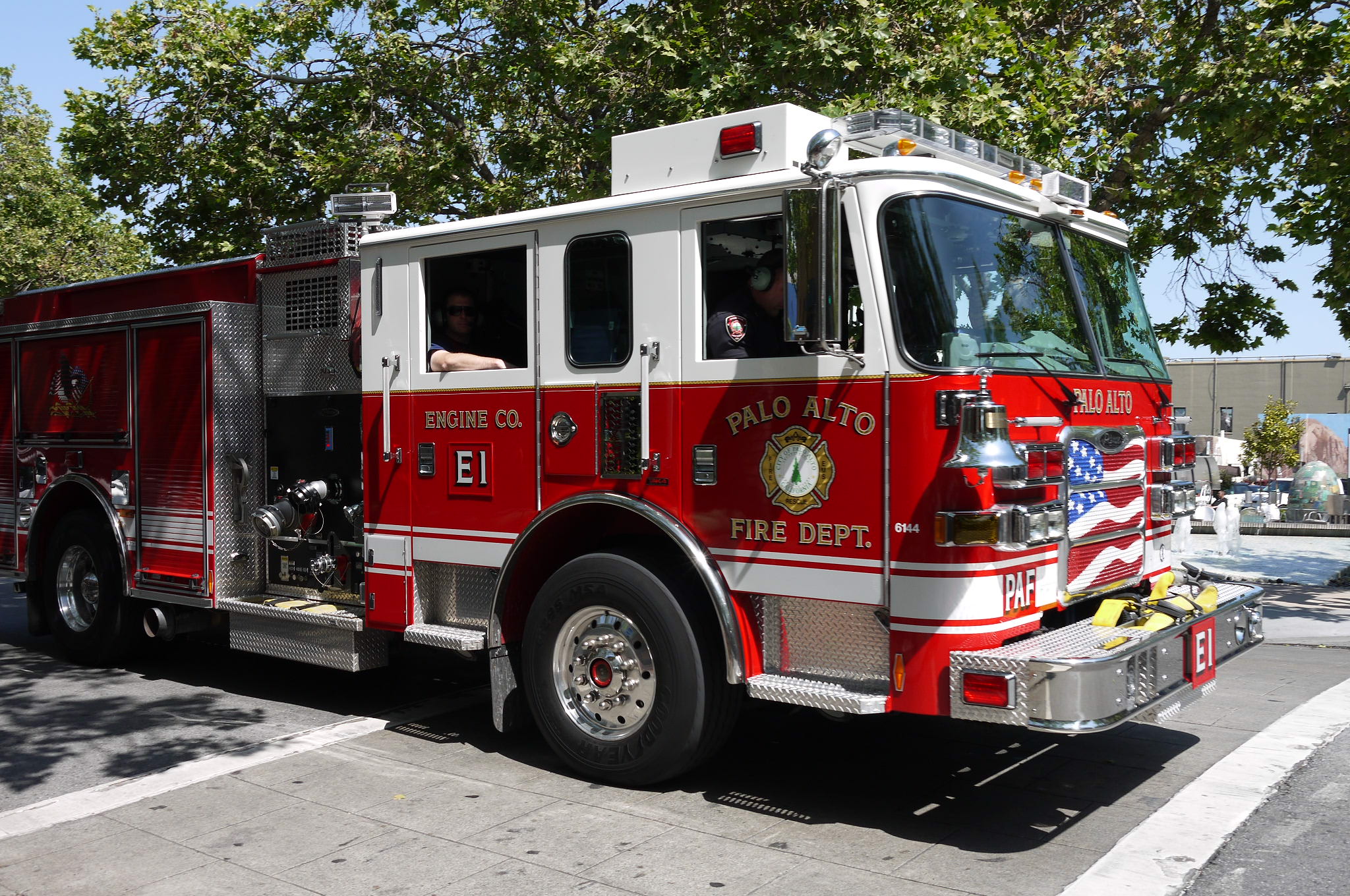 a red fire truck parked on the side of the road