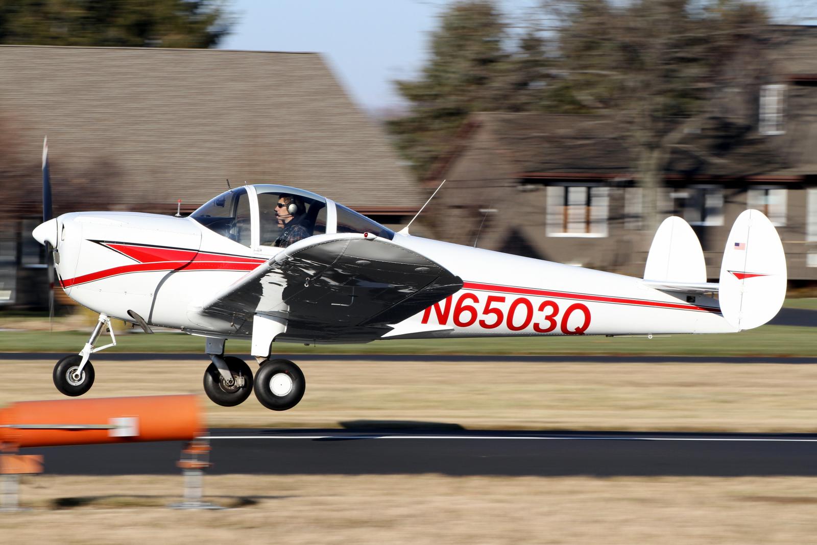 a small propeller plane taking off from a runway