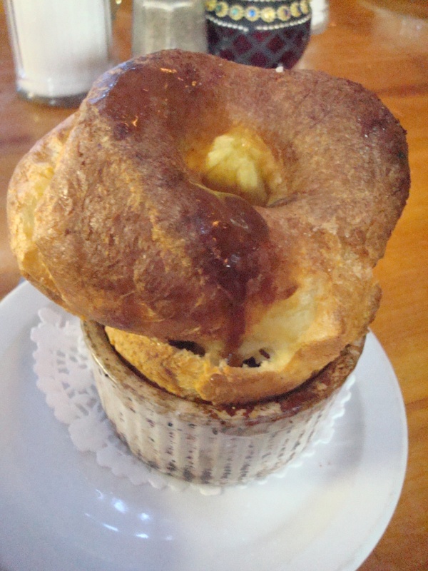 there is an assortment of muffins on a plate