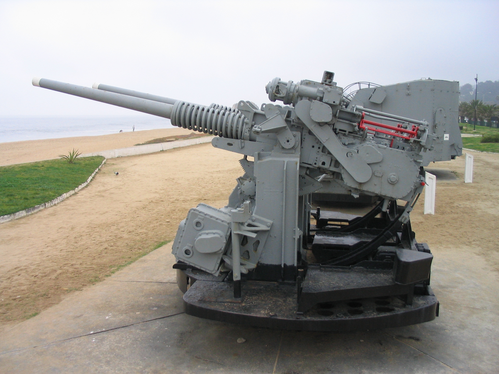 two cannon guns that are on a cart