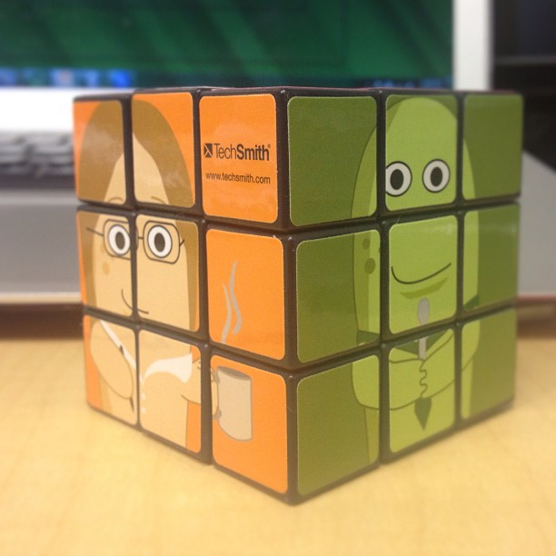 the rubikcun has eyes and faces on it