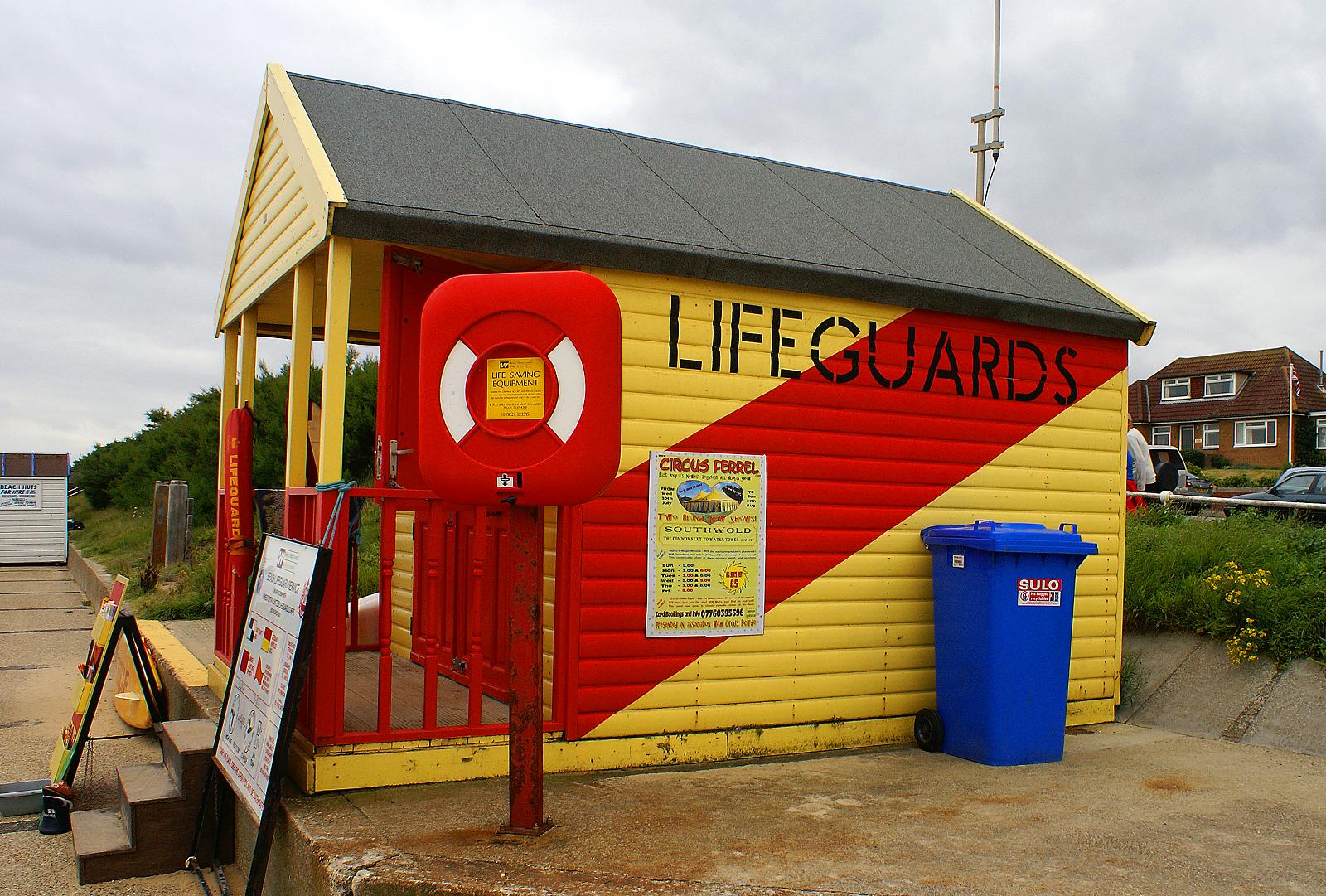 a lifeguards office in front of a red yellow and blue building