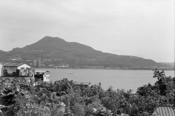 a very large body of water next to a hillside