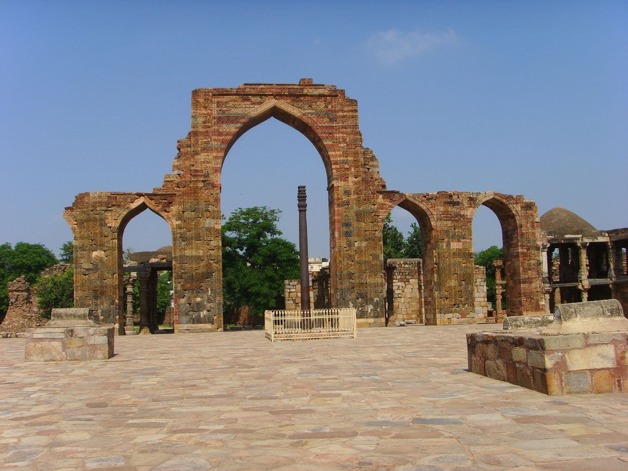 a building made out of stone and brick with an arched archway