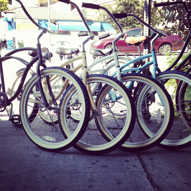 a row of bikes parked outside a building