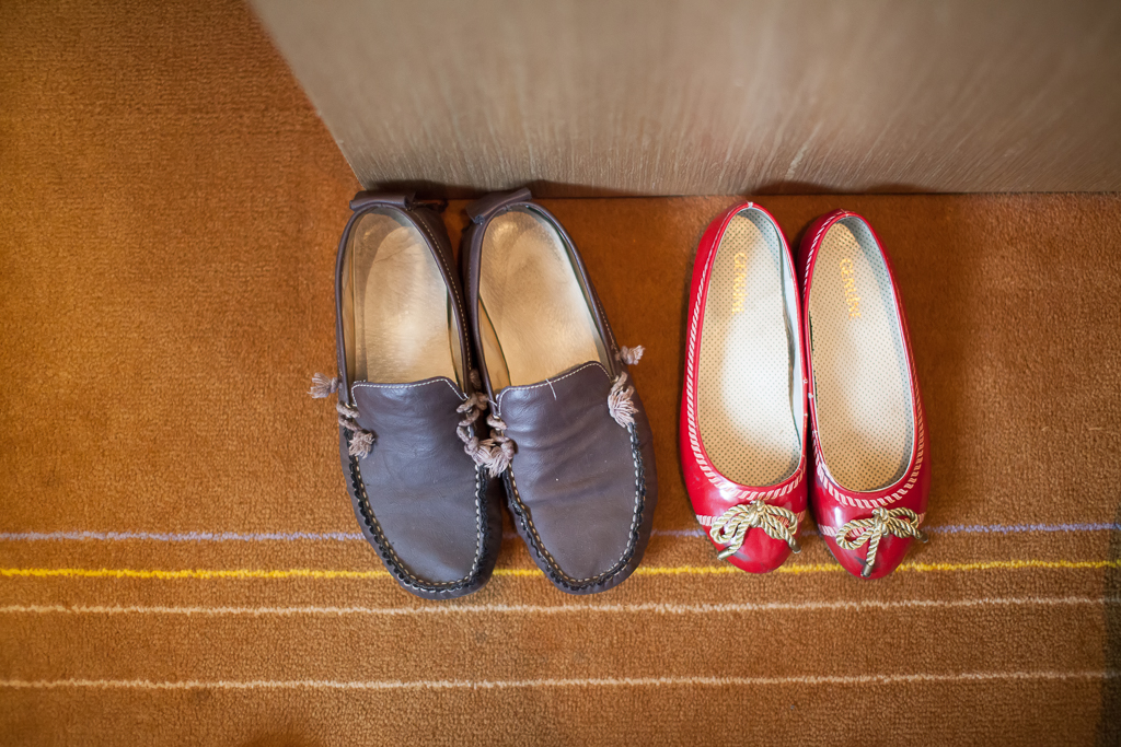 a few people are wearing shoes on the carpet