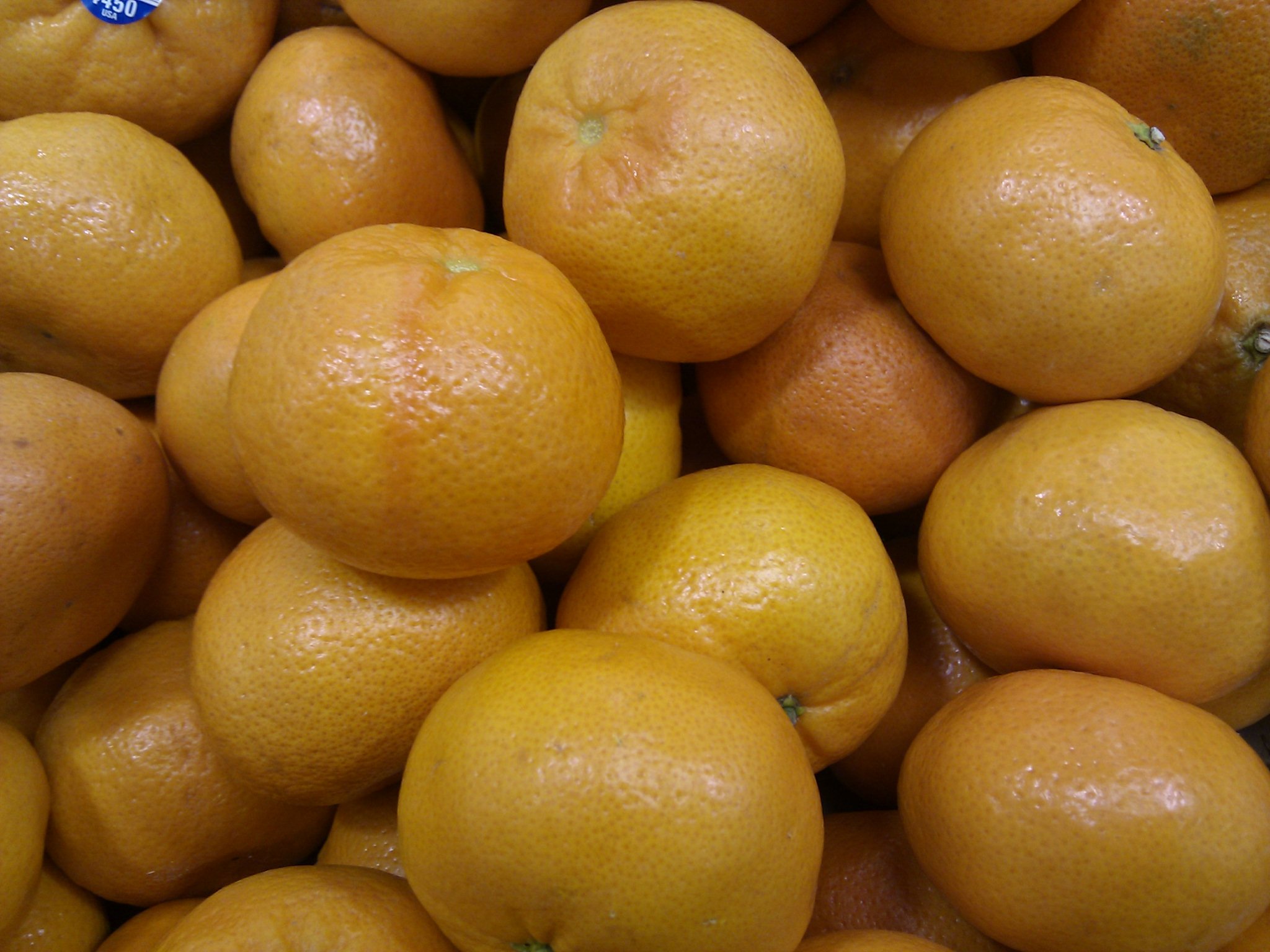 a group of oranges piled on top of each other