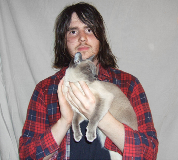 a person holding a cat in their arms