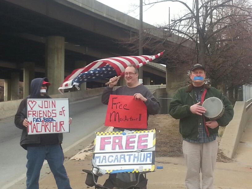 a group of people with signs and masks on