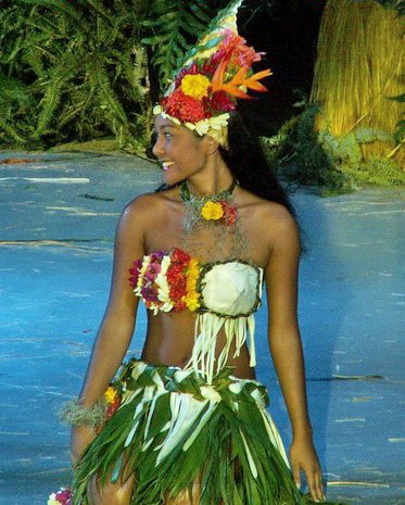 a hawaiian woman walking on the runway