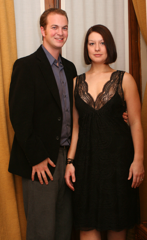 a man and woman posing for a picture