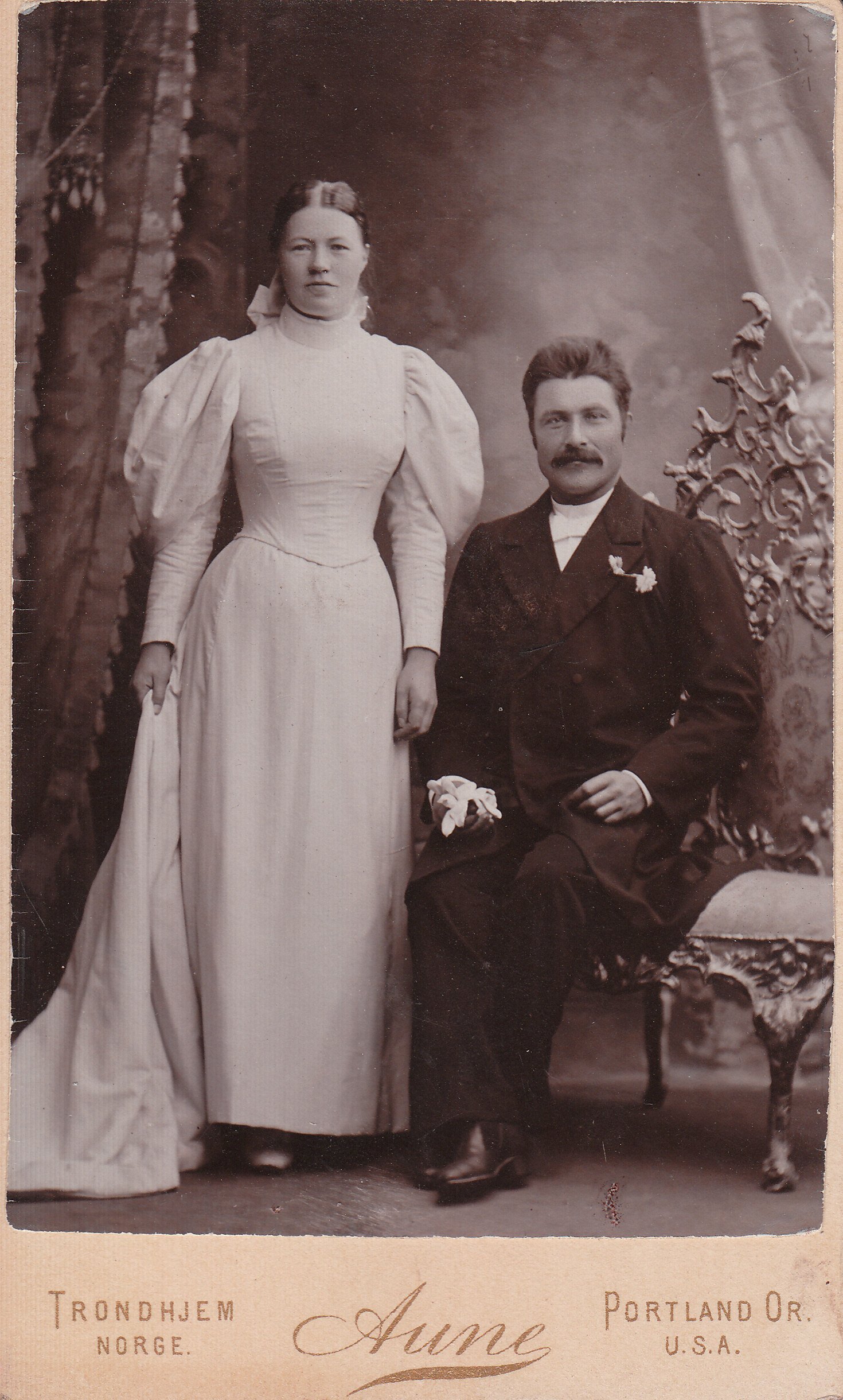 an old black and white pograph of a man and woman