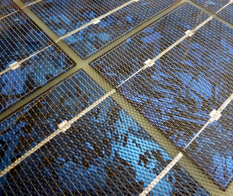 closeup of a blue metal tile wall