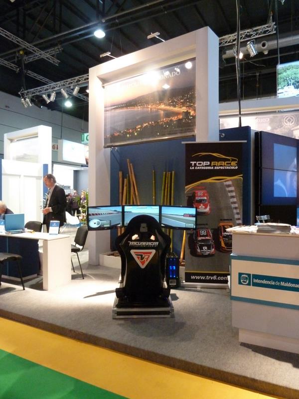 an exhibit booth with several electronic components, including chairs