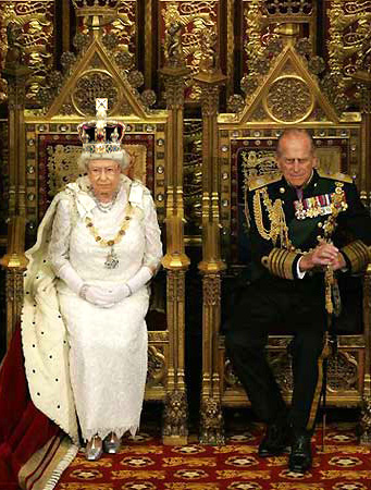 the queen and prince are sitting on ornate thrones