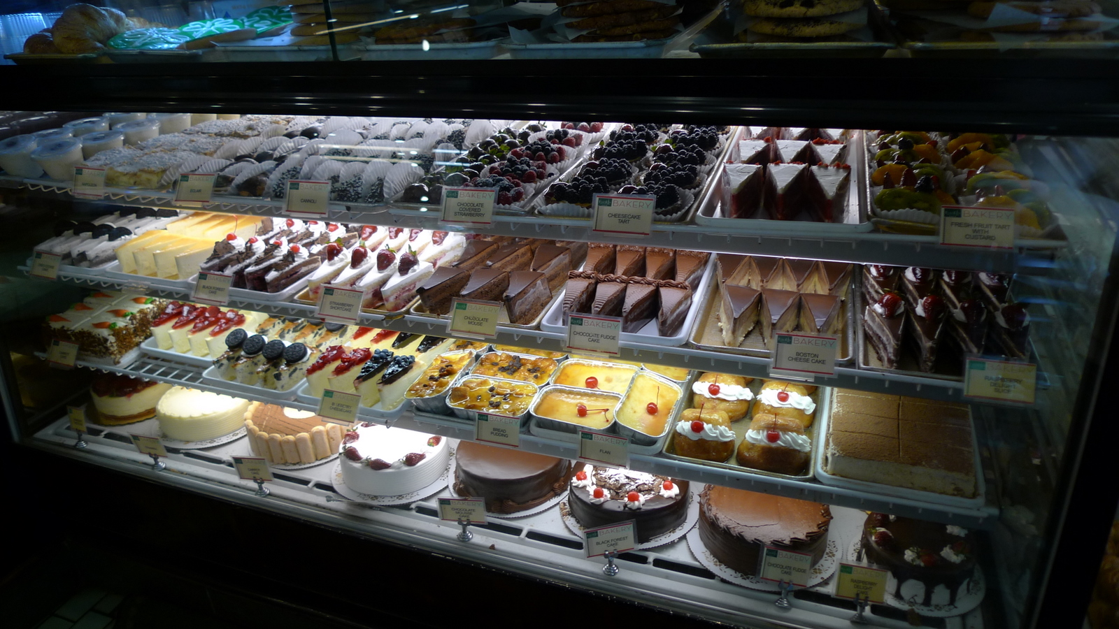 a large pastry display in a display case