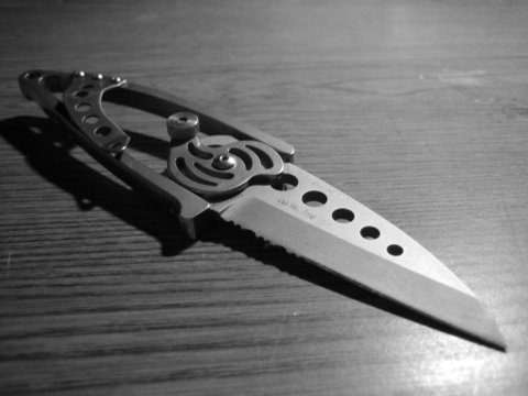 a black and white po of a knife on a table