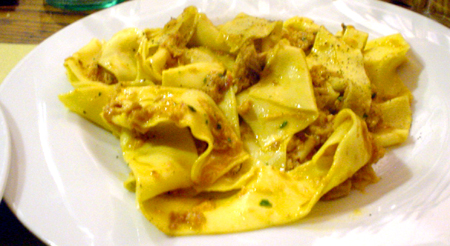 a plate with ravioli and meat on it
