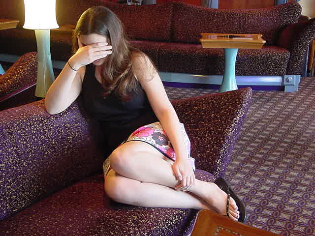 a young woman sitting on top of a couch