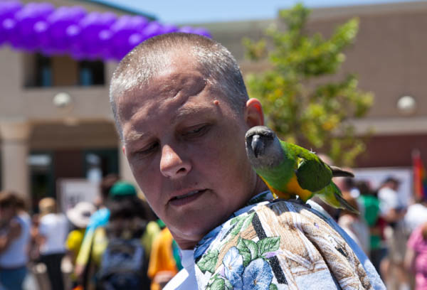 a person with birds on their shoulder