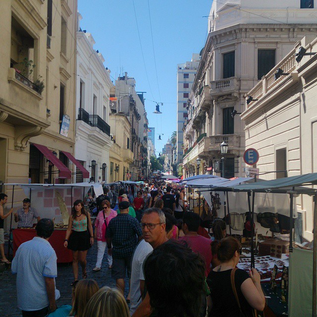 a busy city street filled with lots of people