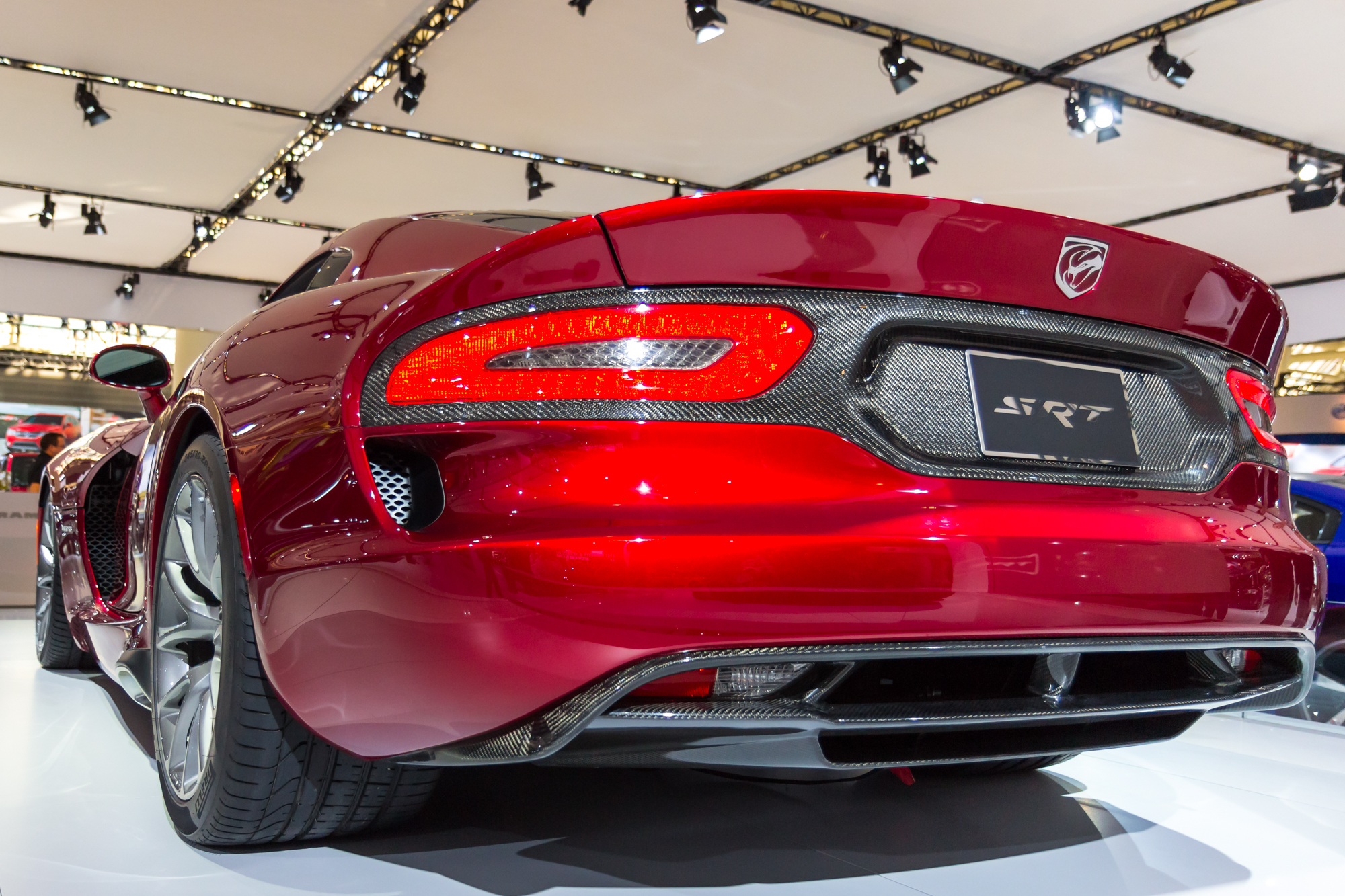 the rear view of a sports car that is on display