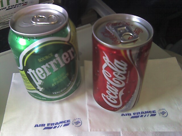 the can has the name perrier on it and the one is in white paper
