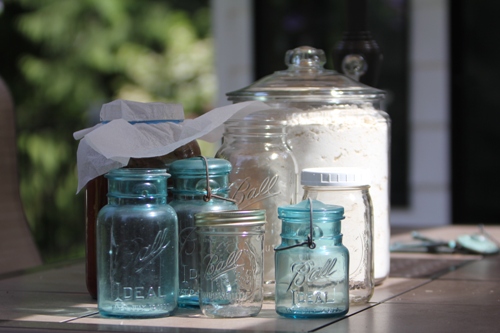 several jars sitting next to each other on a table