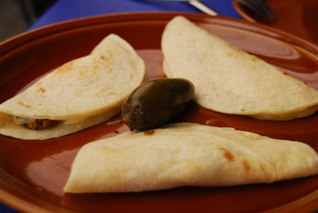 three tortillas that are on top of a plate