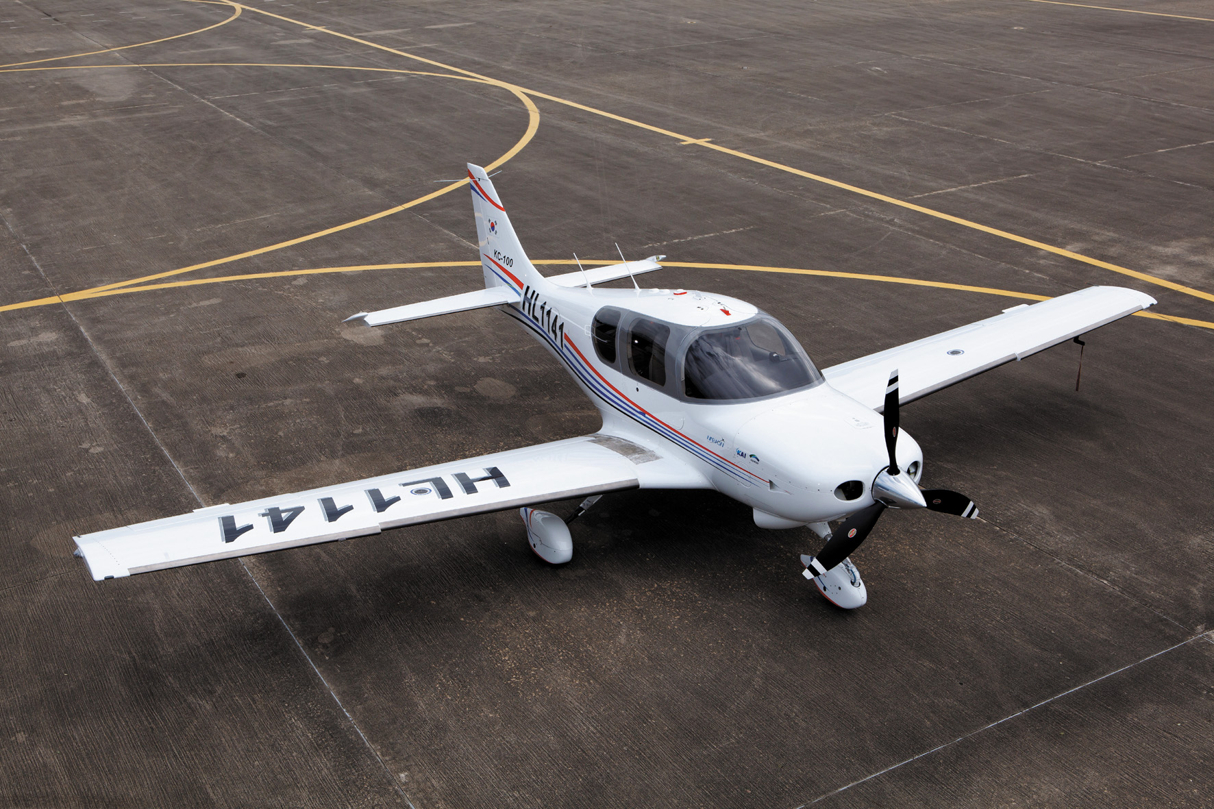 the propeller airplane is sitting on the runway