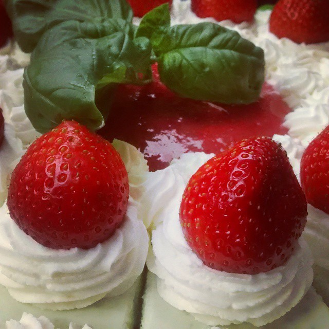 small strawberry cream sandwiches with strawberry sauce and mint leaves