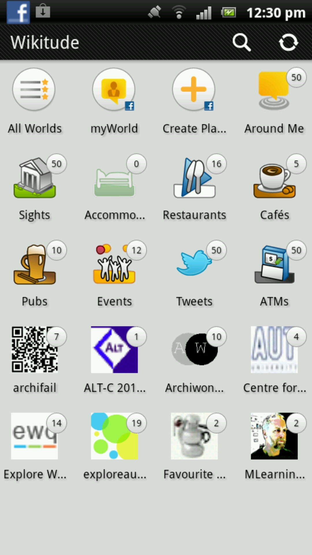 a cellphone is displaying the logo selection of wikipedia