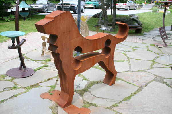 an outdoor sculpture that looks like a dog
