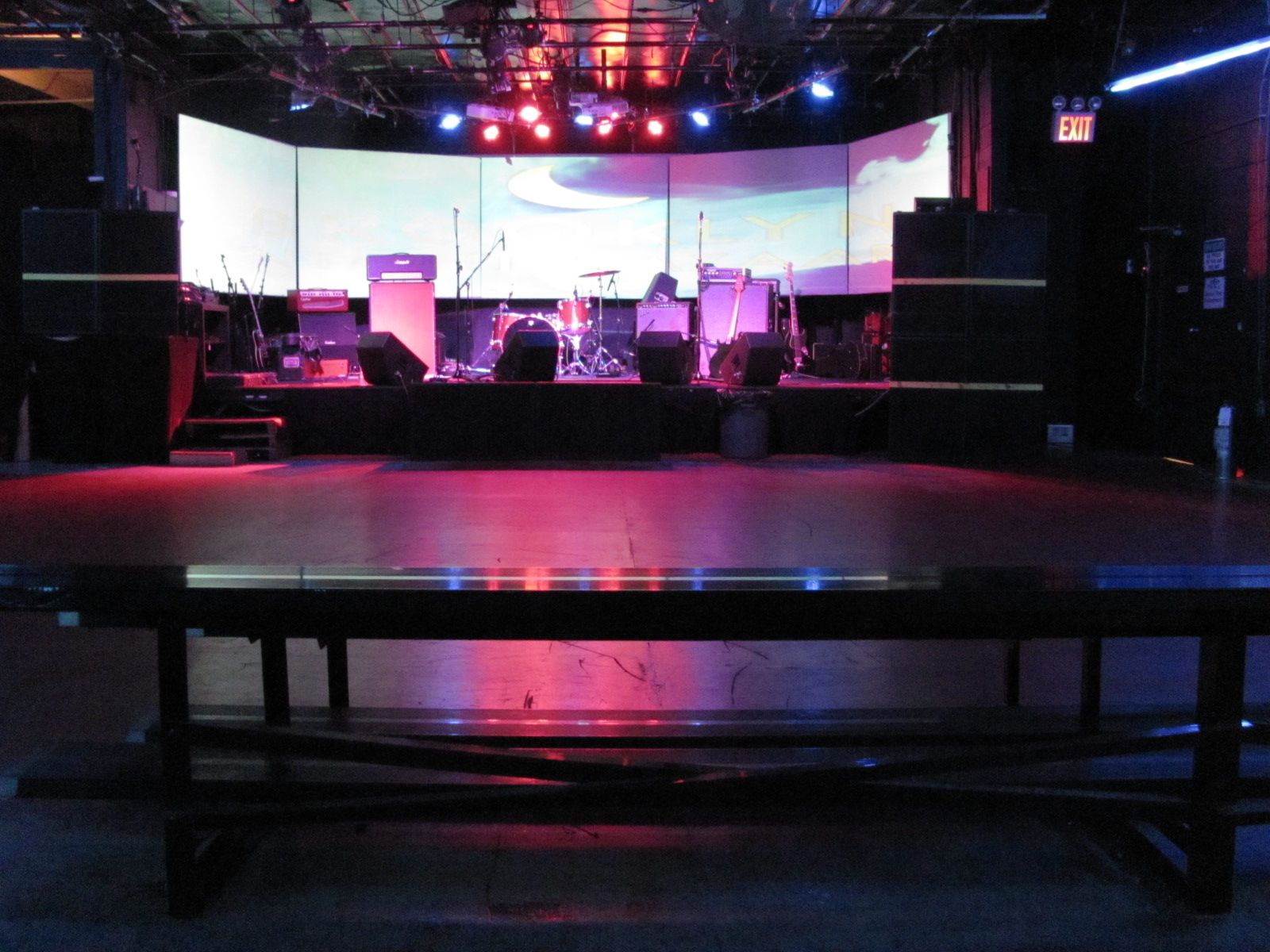 a stage with lights set up in the dark