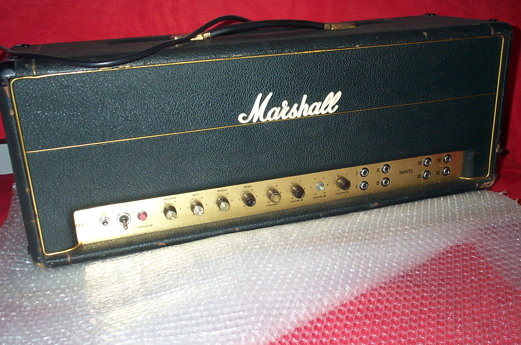 a marshall amp in black sitting on a chair