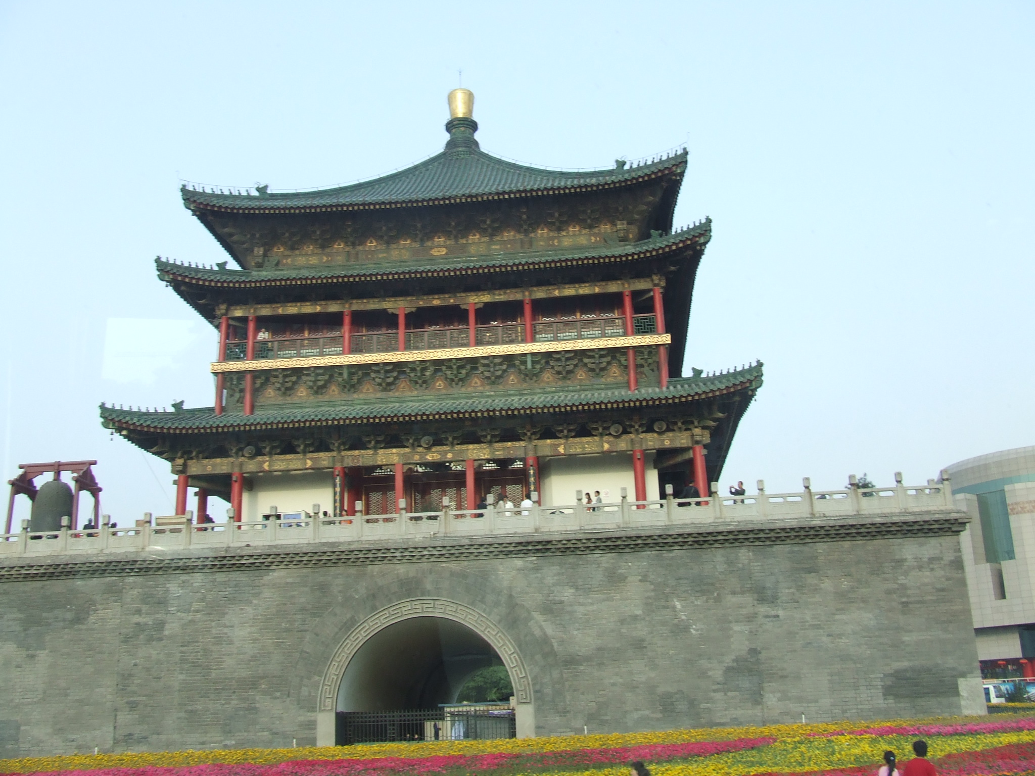 a large tower with multiple red and white decorations